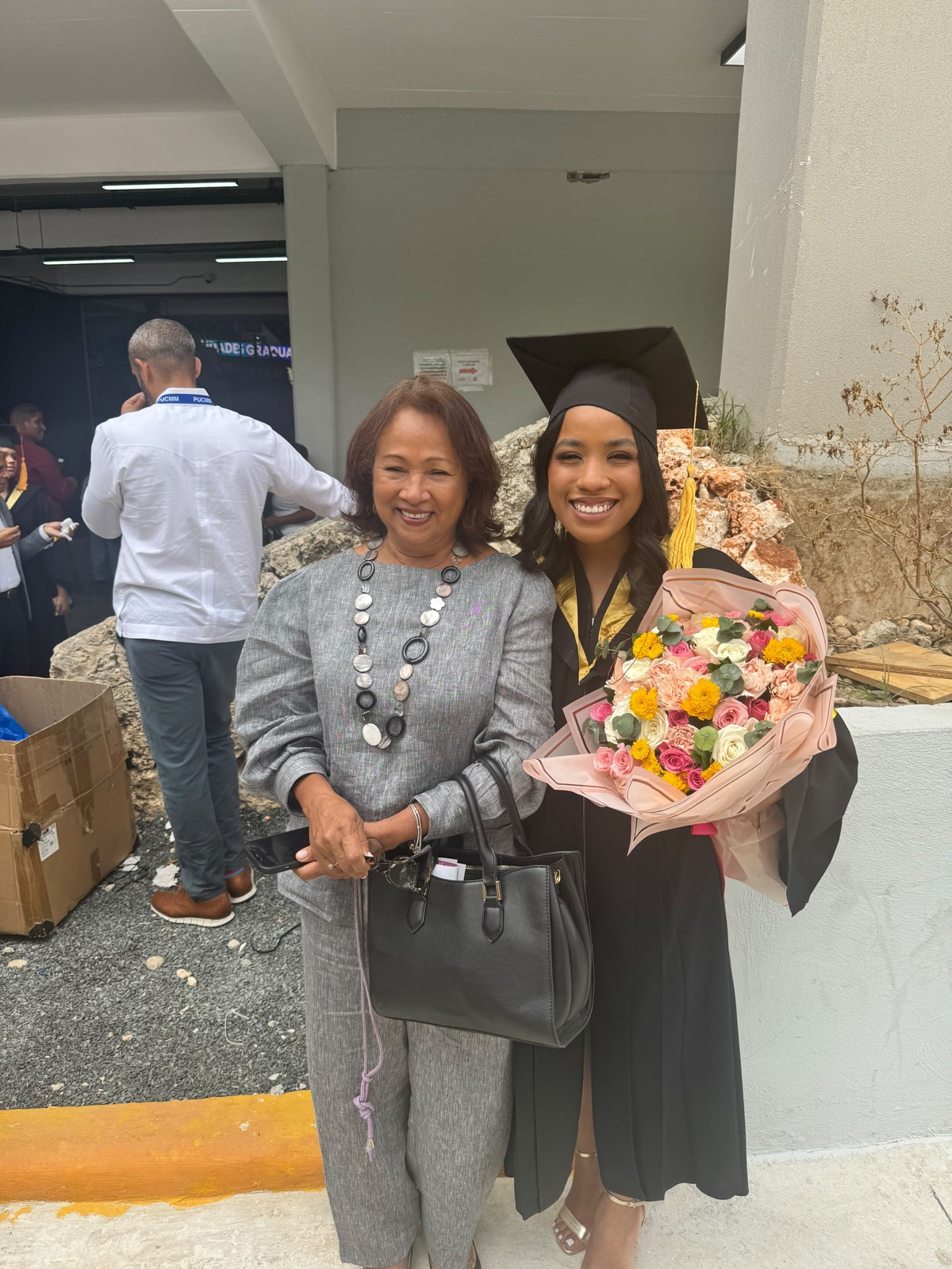 A graduate celebrating with a loved one