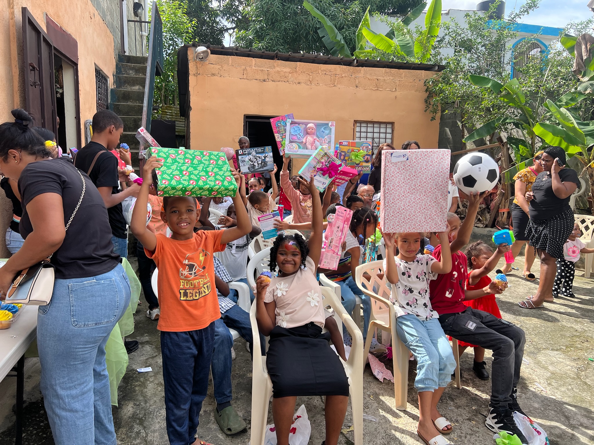 Children celebrating with gifts in the Dominican Republic