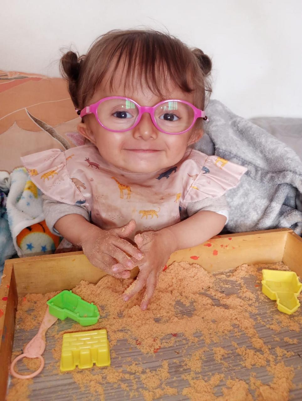 A child smiling during Healing Horizons care