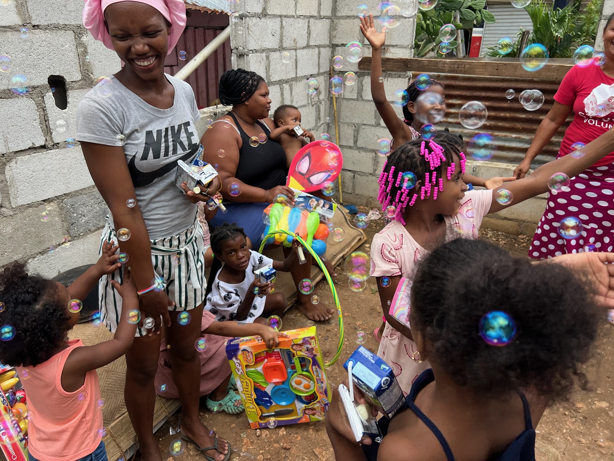 Families and children sharing joyful moments at a Three Kings celebration