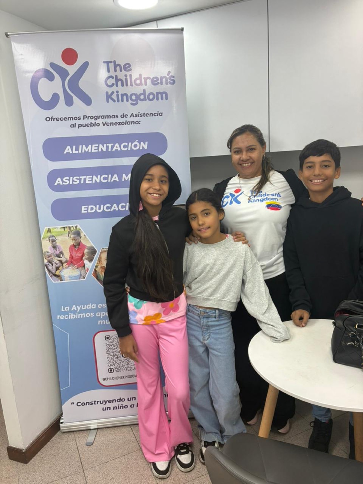 Children and a Children’s Kingdom Foundation team member at a Venezuela community event